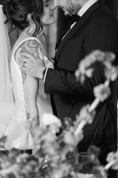 Bride and groom sharing an intimate moment at their Canmore reception.