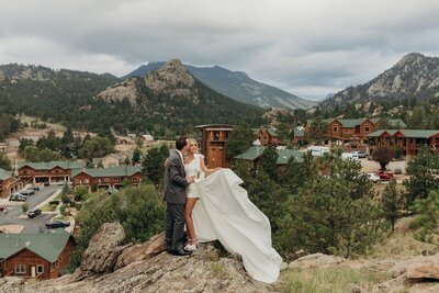 Couple posing at Colorado wedding venue Skyview in Estes Park