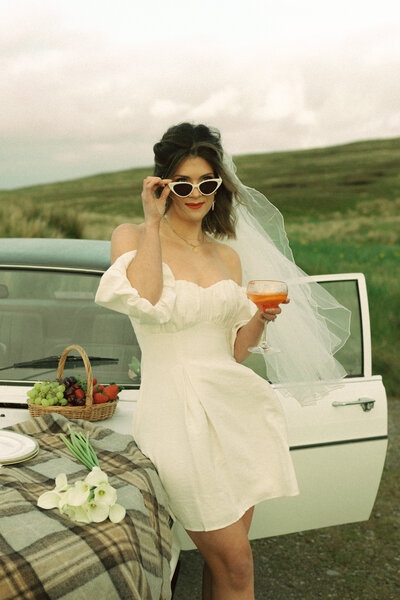 bride picnics on classic car