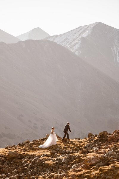 Couple on a mountaintop in Colorado during their wedding day