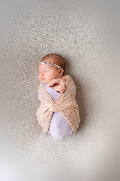 newborn-baby-swaddled-in-a-blanket