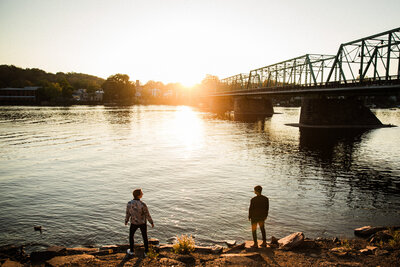 A couple looks out over the Delaware in New Hope, PA during their engagement shoot