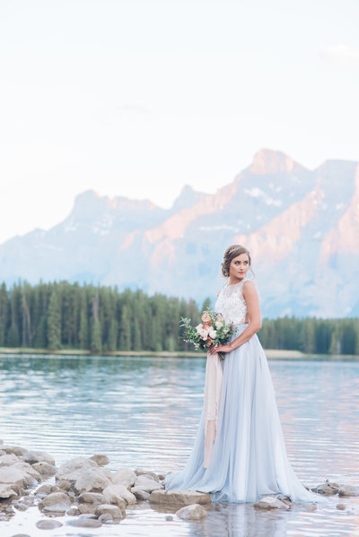photo of bride standing in a mountain valley