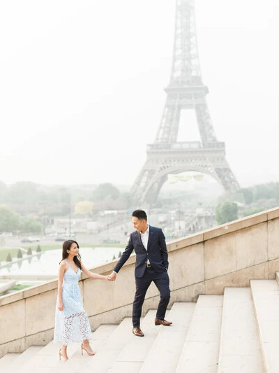 A couple in front of the Eiffel Tower in Paris.