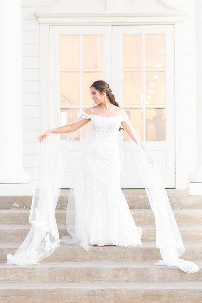 Bride swirls her wedding dress