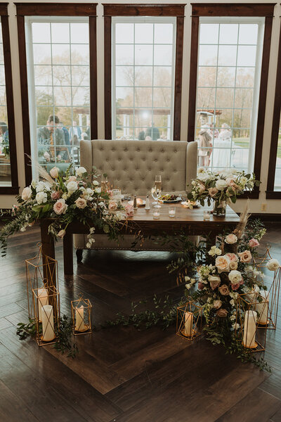 Leigh Florist Design Studio Audubon NJ Sweetheart table with flower and candles