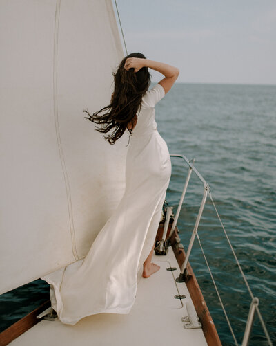 Bride looking out to sea during Nova Scotia Sailboat Elopement