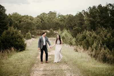 Couple walking hand in hand in Little Rock Arkansas Engagement Session