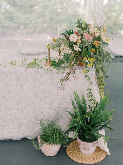 Wedding sweetheart table with elegant linens and florals