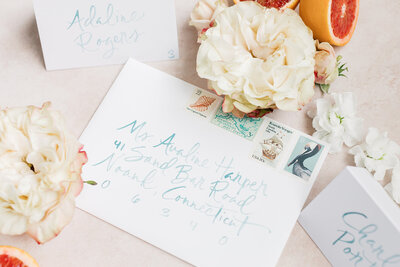 Blue watercolor brush lettering on white envelopes  for weddings