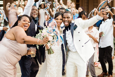 Black Bride and groom celebrate with family