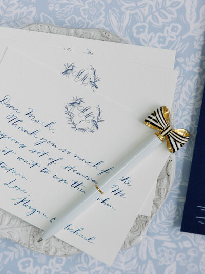 Handwritten thank you note featuring a custom heron monogram crest