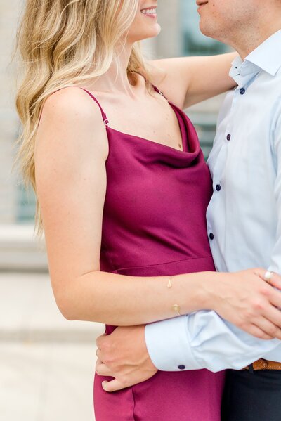 Newly engaged couple embrace during engagement photoshoot in Minneapolis.