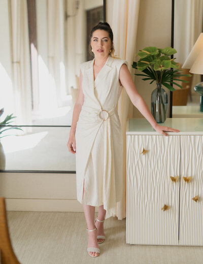 chic headshot of kaylyn leighton in white professional business outfit.