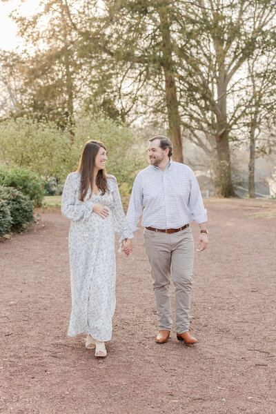 Pregnant wife holding husbands hand -Newborn Photography Greenville SC