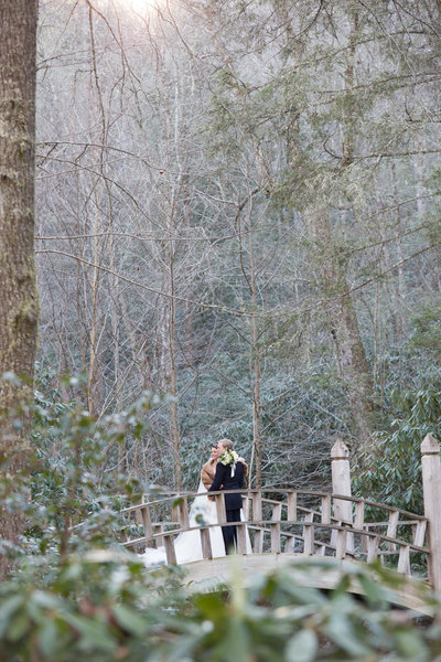 Bride and Groom on Bridge in Winter at Old Edwards Inn Highlands NC