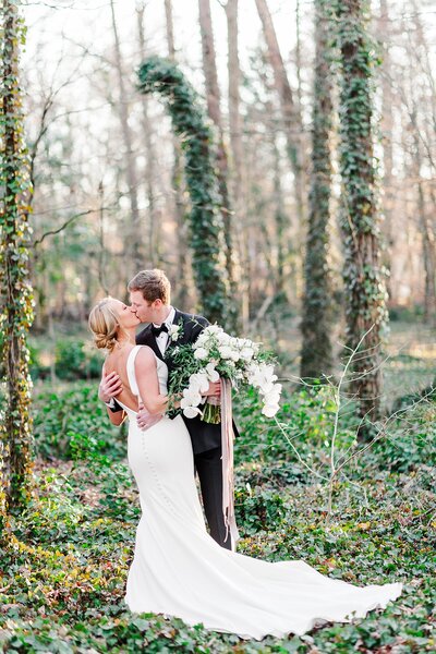 groom kissing bride by Knoxville Wedding Photographer, Amanda May Photos