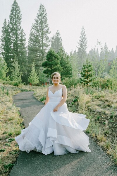 playful bride Martis camp in truckee in a candid moent