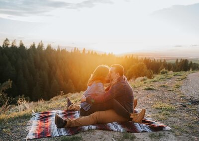 Sacramento Wedding Photographers capture couple sitting together during picnic