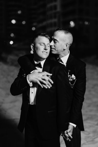 two grooms embracing