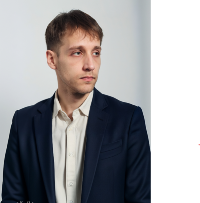 Professional portrait of Wedding Photographer Niko Coric wearing navy blazer and light shirt 