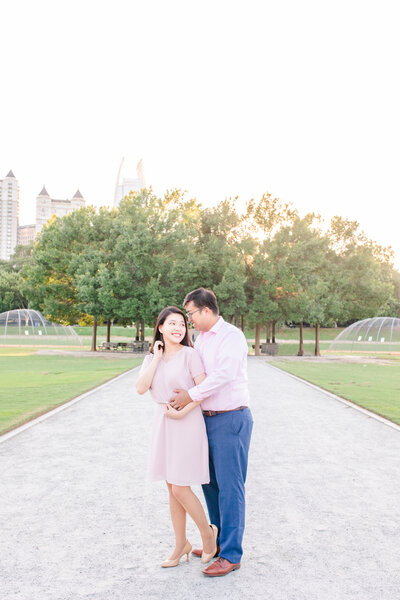 A couple at their engagement session at Piedmont Park in Atlanta Georgia by Jennifer Marie Studios, best Georgia wedding photographer.