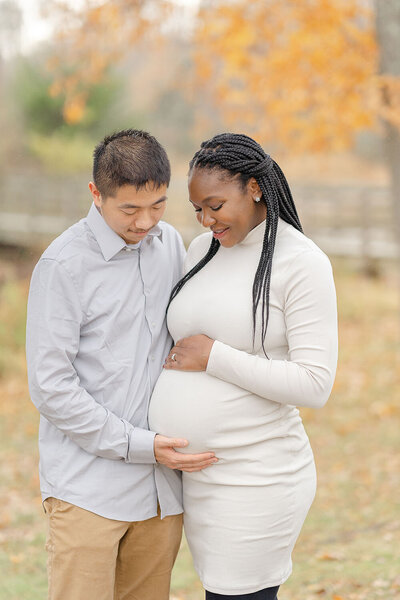 expecting parents excited to welcome baby during Ashburn, Virginia fall mini session