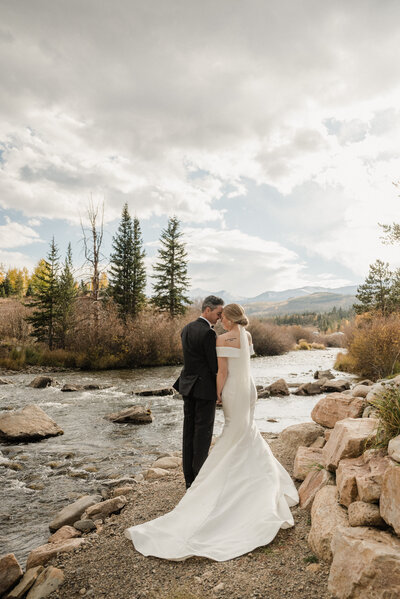 Bride and groom share a quiet moment in the mountains after their intimate elopement in Breckenridge, Colorado