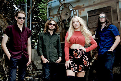 Nashville Tennesse band portrait Juliana Hale And Band of Roses standing against trailer and trees