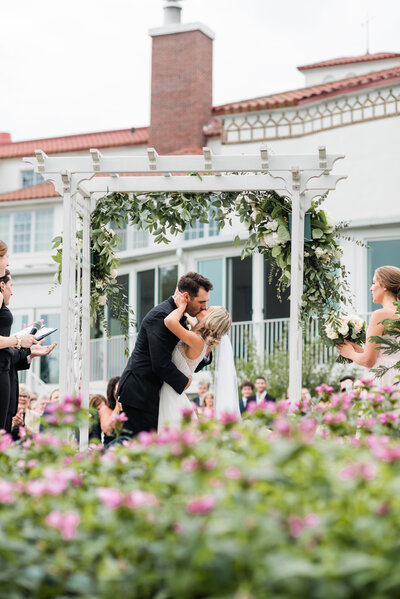 Couple kiss at the altar at the Lafayette Club