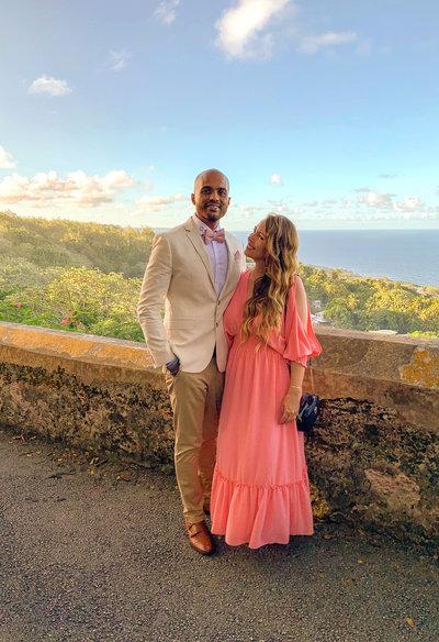 Candice and her husband Jason dressed fancy for a wedding overlooking the gorgeous views of Barbados