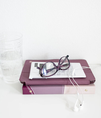 Notebook, tablet and glasses with headphones.