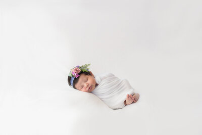 Blanket posed newborn girl during an in -home  Philadelphia Newborn Session