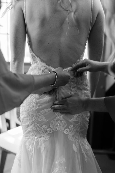 Bride Getting into Dress - Megan & Amber | Hood River Wedding  - LGBTQ Wedding