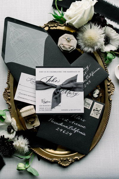 This image by Tiffany Longeway highlights the elegance and boldness of a bespoke wedding invitation, showcasing intricate designs and luxurious details that set the tone for a grand celebration.