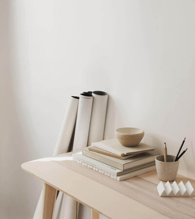 Desk with accessories and architectural plans