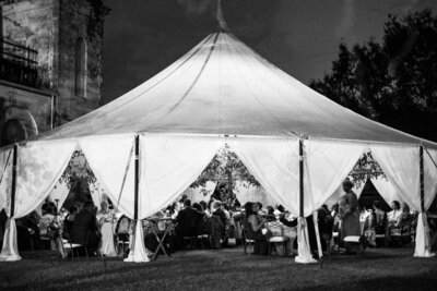Black and white outdoor event tent at night