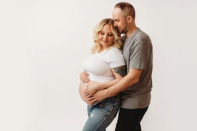 Expectant Parents pose for Studio Maternity Photoshoot in Asheville, NC.