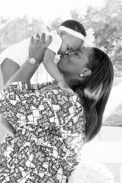 mom kissing daughter taken by a family photographer in Northern Virginia