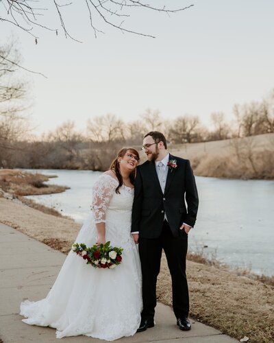 bride and groom on riverwalk