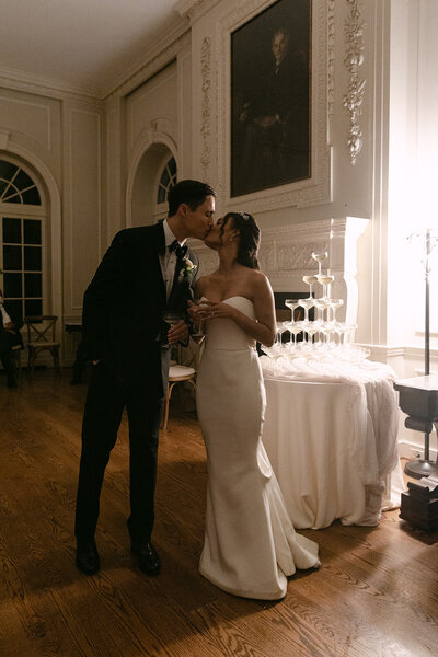 Bride and Groom kissing pose in a room