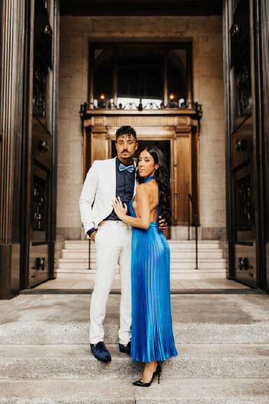 couple-posing-in=front-of-town-hall