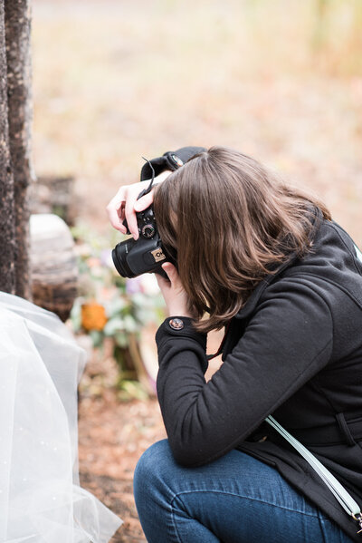 Seattle Wedding Photographer captures woman taking photos of washington wedding details