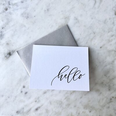 Card that reads "Hello" in cursive script