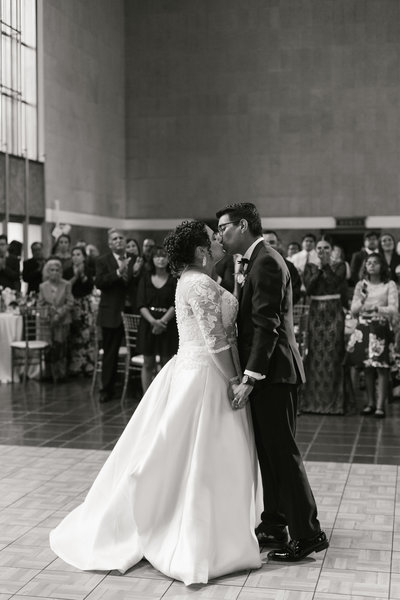 couple shares a first dance kiss at Union Station wedding in LA