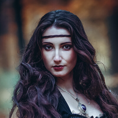 Woman with long dark hair in medieval dress