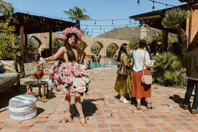 Immersive entertainer wearing a rose costume and dancing at the bachelor mansion