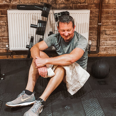 Man in his 40s sweating after a workout with kt chaloner