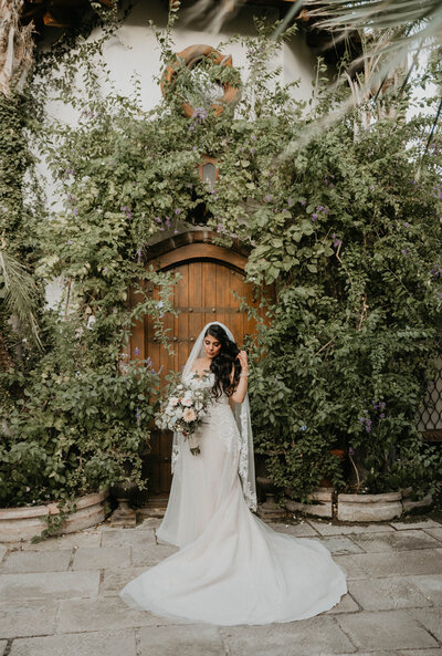 bride posing by ivy