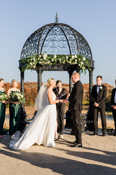 Couple standing in front of the altar during ceremony